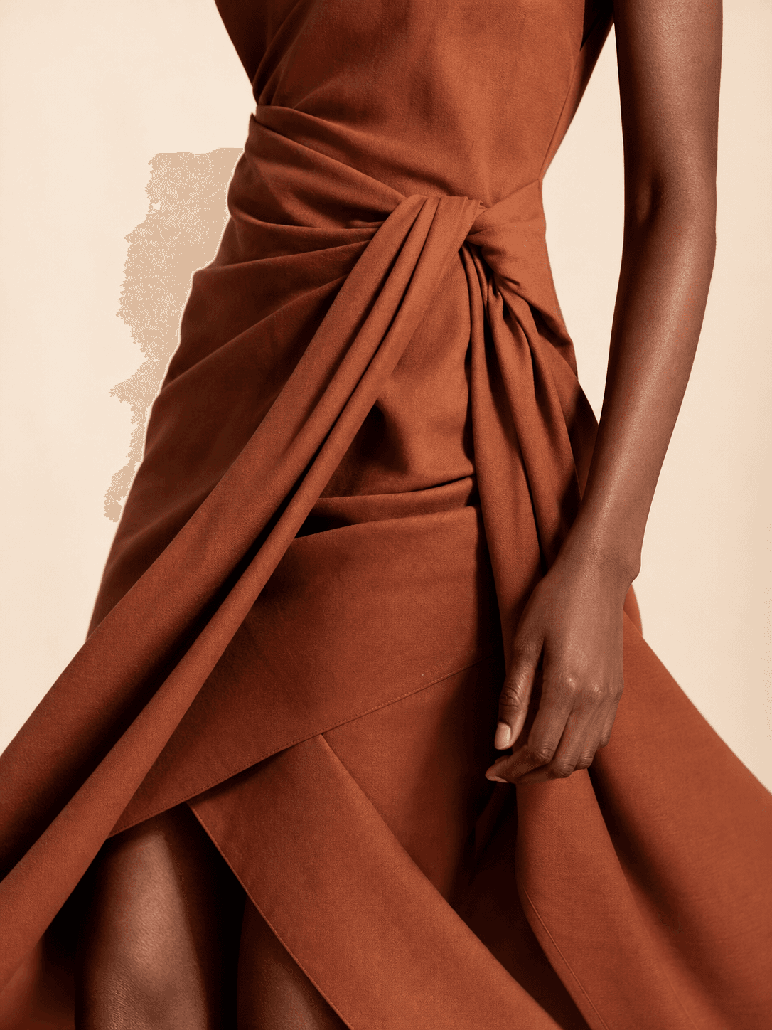 Concept close-up of clay-brown dress draping