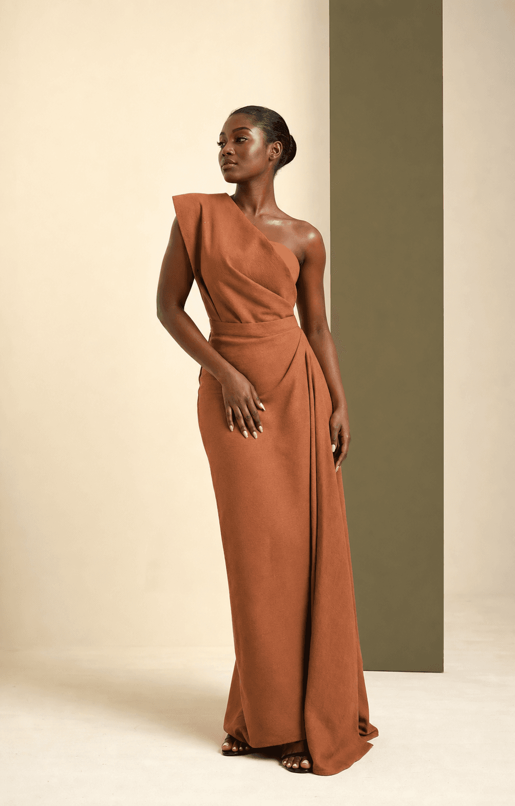 Concept campaign portrait of a woman in a clay-brown dress