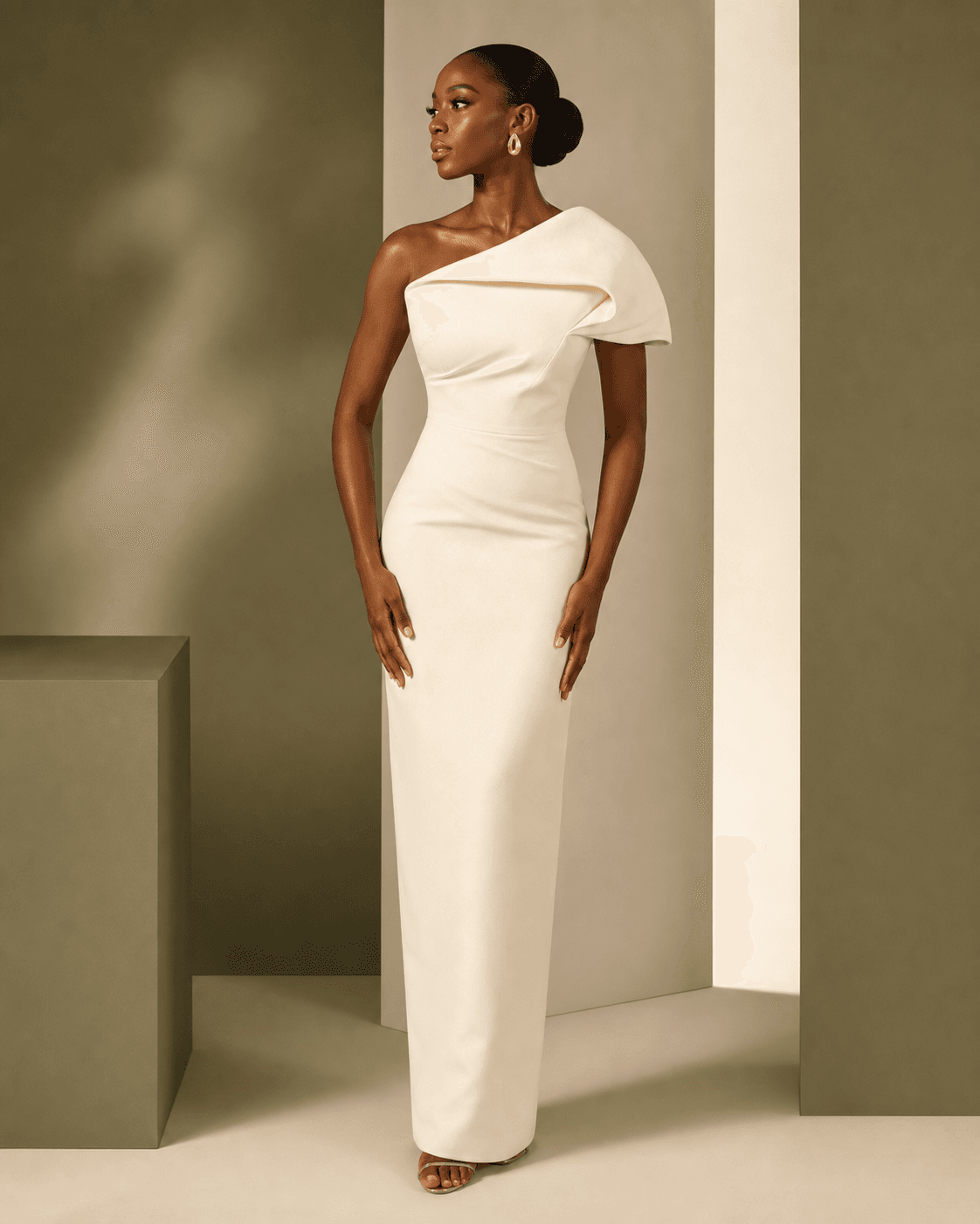 Concept presentation of a sculptural ivory column dress